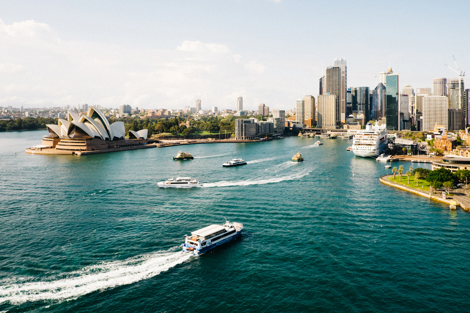 Sydney Opera House, ferries and the city skyline across Sydney Harbour